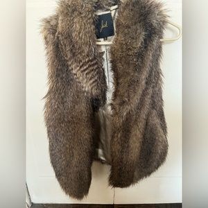 Faux Fur vest beautiful statement piece can be dressed up or down NWOT